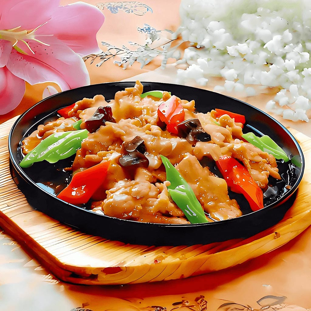 Vită la plită încinsă, un fel principal cu carne fragedă de vită și legume (ardei, bambus, ciuperci, urechi de lemn) gătite în wok, servit la restaurantul Jin Ding din Sector 2, București. Preț 55 LEI/350g.